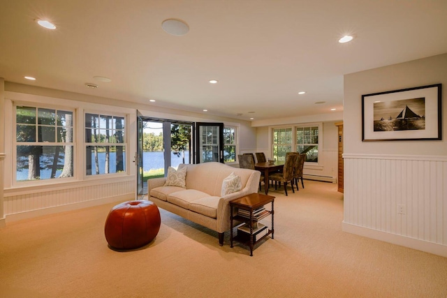 19 Vista Way, Mount Desert, ME 04660 - living room with light carpet, recessed lighting, a wainscoted wall, a baseboard radiator, and a decorative wall