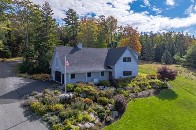 19 Vista Way, Mount Desert, ME 04660 - view of front facade featuring driveway, an attached garage, a front yard, and a view of trees