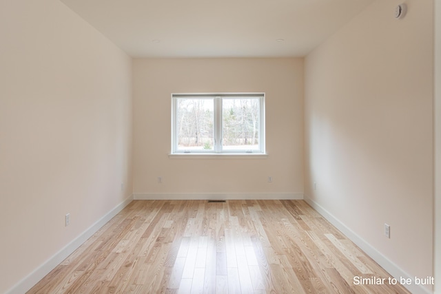 4 Windward Rdg, Biddeford, ME 04005 - spare room with light wood-style flooring and a smoke detector