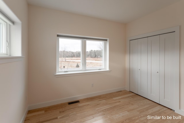 4 Windward Rdg, Biddeford, ME 04005 - unfurnished bedroom with wood finished floors and a closet