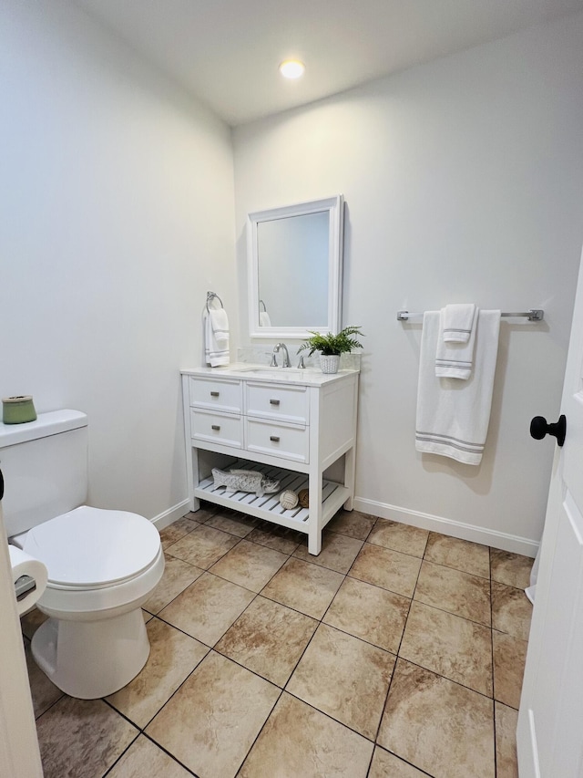 23 Ichabod Ln, Hampden, ME 04444 - bathroom with vanity, toilet, and baseboards