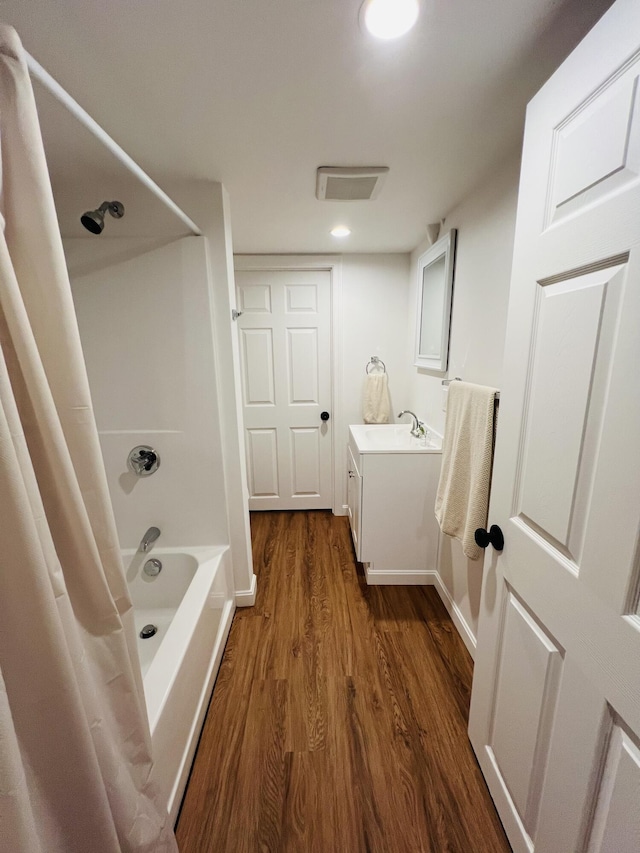 23 Ichabod Ln, Hampden, ME 04444 - bathroom featuring wood finished floors, vanity, and shower / bath combo