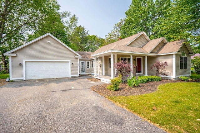 38 Shadagee Rd, Saco, ME 04072 - view of front facade featuring asphalt driveway, a garage, a shingled roof, a front lawn, and covered porch