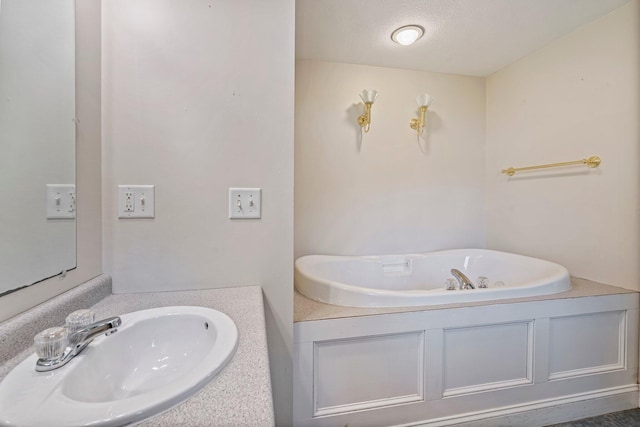 38 Shadagee Rd, Saco, ME 04072 - bathroom featuring a bath, vanity, and a textured ceiling