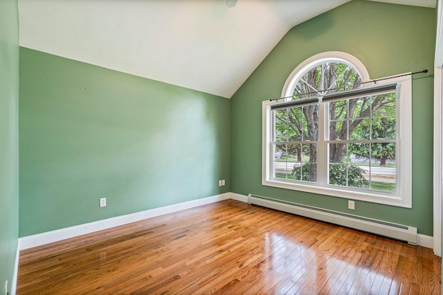 38 Shadagee Rd, Saco, ME 04072 - spare room featuring a baseboard radiator, hardwood / wood-style floors, vaulted ceiling, and baseboards