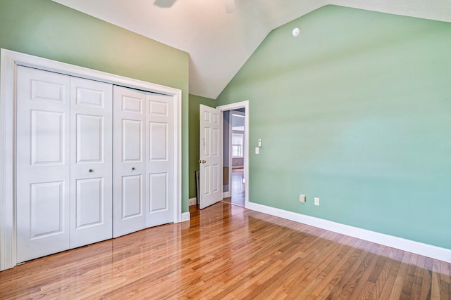 38 Shadagee Rd, Saco, ME 04072 - unfurnished bedroom with vaulted ceiling, light wood-style floors, baseboards, a closet, and a ceiling fan