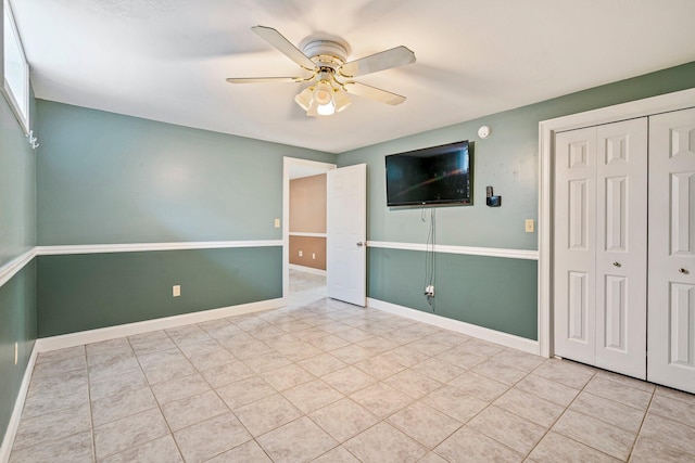 38 Shadagee Rd, Saco, ME 04072 - unfurnished bedroom featuring tile patterned flooring, a closet, baseboards, and ceiling fan