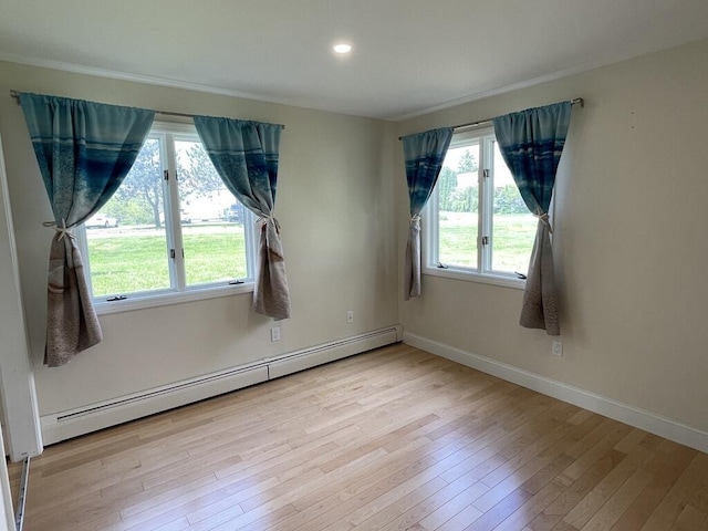 101-2 Waldo Ave Unit 3, Belfast, ME 04915 - spare room with baseboard heating, hardwood / wood-style floors, baseboards, recessed lighting, and ornamental molding