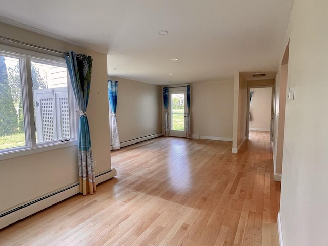 101-2 Waldo Ave Unit 3, Belfast, ME 04915 - spare room with a baseboard heating unit, light wood-type flooring, a baseboard radiator, baseboards, and recessed lighting
