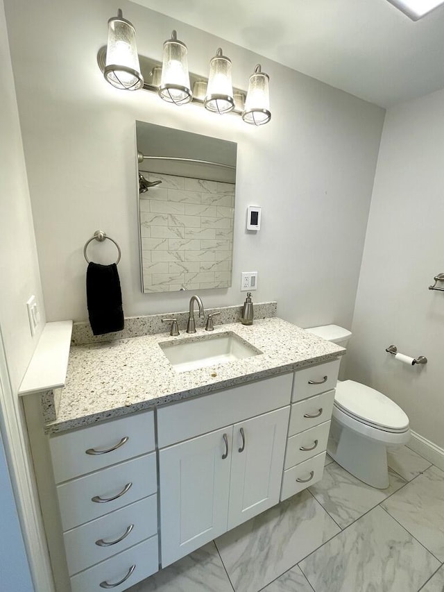 101-2 Waldo Ave Unit 3, Belfast, ME 04915 - full bath with marble look tile flooring, vanity, toilet, and a shower