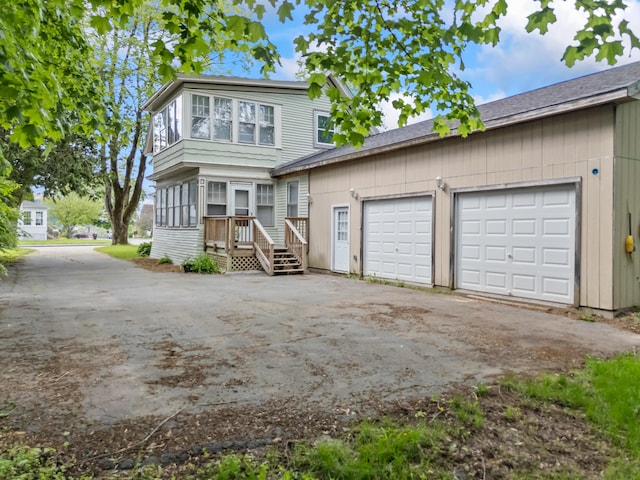 10 Hollingsworth St, Winslow, ME 04901 - view of front of house featuring driveway, an attached garage, and a deck