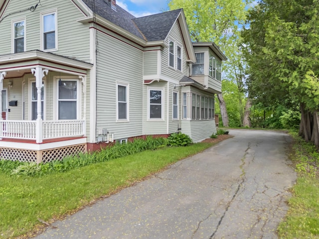 10 Hollingsworth St, Winslow, ME 04901 - view of home's exterior featuring a porch and roof with shingles