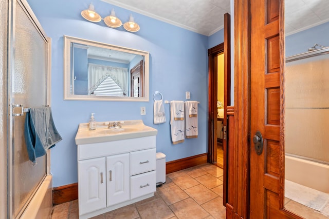 10 Hollingsworth St, Winslow, ME 04901 - full bath with vanity, baseboards, enclosed tub / shower combo, and crown molding