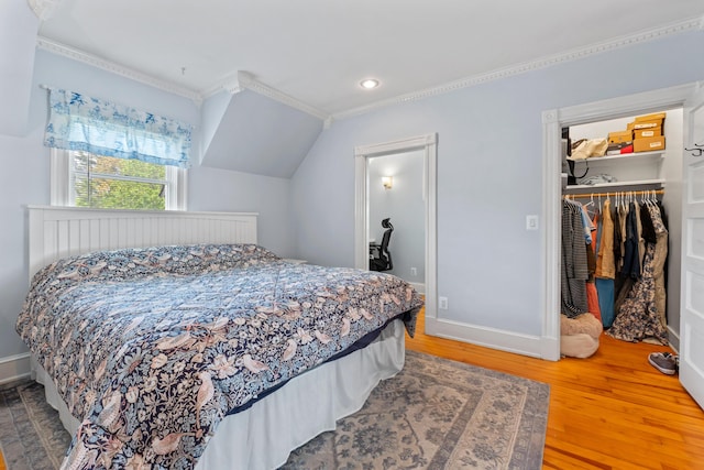 10 Hollingsworth St, Winslow, ME 04901 - bedroom featuring crown molding, wood finished floors, recessed lighting, a walk in closet, and baseboards