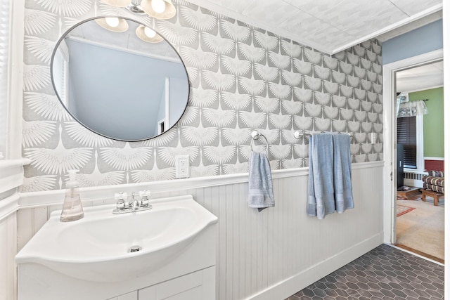 10 Hollingsworth St, Winslow, ME 04901 - bathroom with vanity and a wainscoted wall