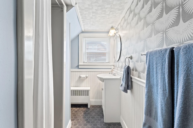 10 Hollingsworth St, Winslow, ME 04901 - full bath with radiator heating unit, vanity, baseboards, a wainscoted wall, and wallpapered walls