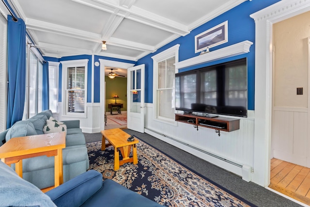 10 Hollingsworth St, Winslow, ME 04901 - living room with baseboard heating, coffered ceiling, a wainscoted wall, beam ceiling, and ceiling fan