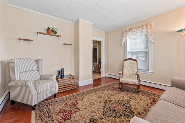 10 Hollingsworth St, Winslow, ME 04901 - sitting room featuring ornamental molding, wood finished floors, and baseboard heating