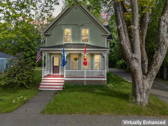 10 Hollingsworth St, Winslow, ME 04901 - view of front of home with covered porch, a front lawn, and roof with shingles