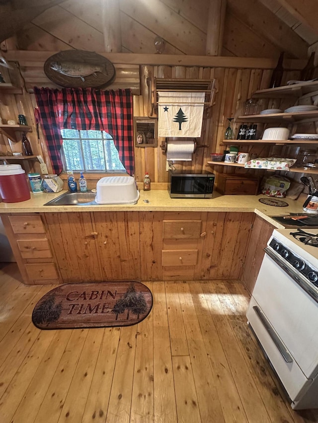 30 Cove View Ln Unit T3, Indian Purchase Twp, ME 04462 - kitchen featuring white gas range, stainless steel microwave, open shelves, and light wood-type flooring