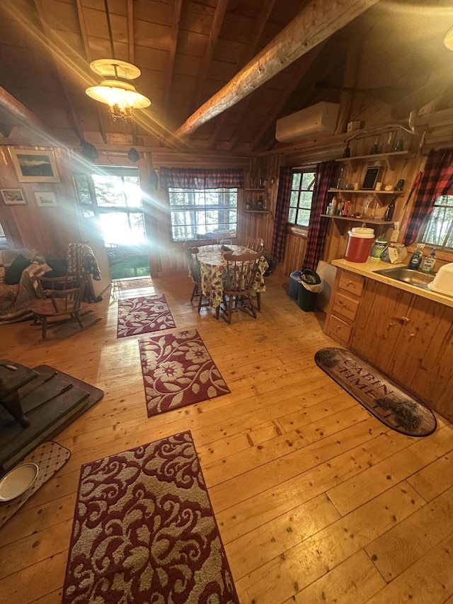 30 Cove View Ln Unit T3, Indian Purchase Twp, ME 04462 - dining space with a wall mounted air conditioner and hardwood / wood-style floors