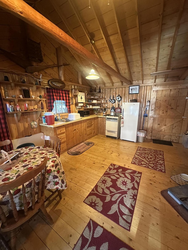 30 Cove View Ln Unit T3, Indian Purchase Twp, ME 04462 - kitchen featuring white appliances, light wood-style floors, wooden ceiling, wood walls, and a peninsula