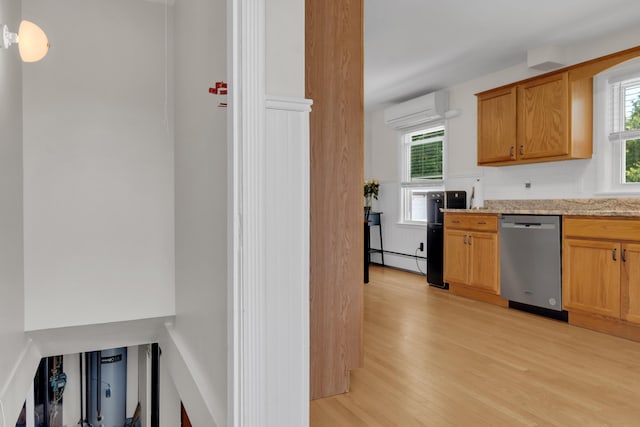 6 Goff Ave, Lewiston, ME 04240 - kitchen with dishwasher, a wall mounted air conditioner, light wood-type flooring, a baseboard heating unit, and light stone countertops