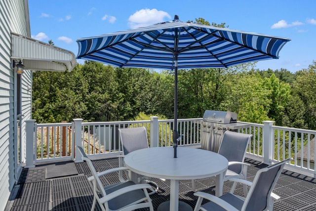 6 Goff Ave, Lewiston, ME 04240 - wooden deck featuring outdoor dining space, a grill, and a wooded view