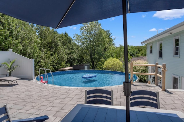 6 Goff Ave, Lewiston, ME 04240 - swimming pool with a patio and view of wooded area