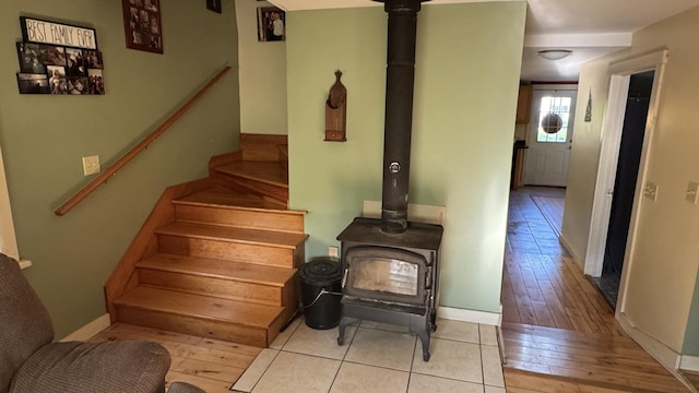 40 Justin Ln, Hermon, ME 04401 - stairway with a wood stove, hardwood / wood-style flooring, and baseboards