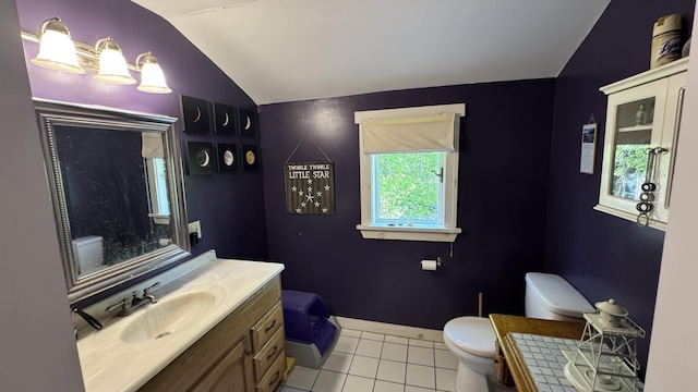40 Justin Ln, Hermon, ME 04401 - bathroom featuring toilet, lofted ceiling, tile patterned floors, and vanity