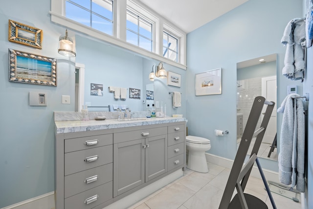 7 First St, Biddeford, ME 04006 - full bathroom with vanity, baseboards, toilet, and a shower