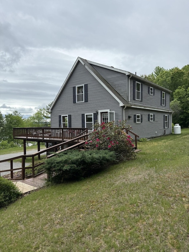 156 Lakeshore Dr, Leeds, ME 04263 - back of property with a deck and a lawn