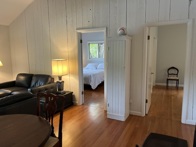170 Molyneaux Rd, Camden, ME 04843 - living room with light wood-style flooring, baseboards, and wooden walls