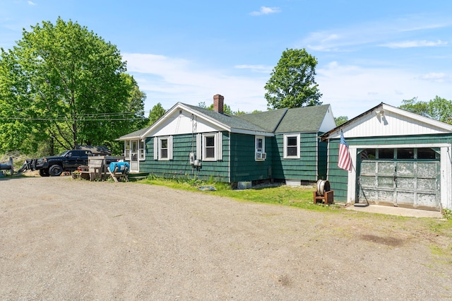 54 Middle Rd, Augusta, ME 04330 - view of front of house with driveway, a chimney, and a shingled roof