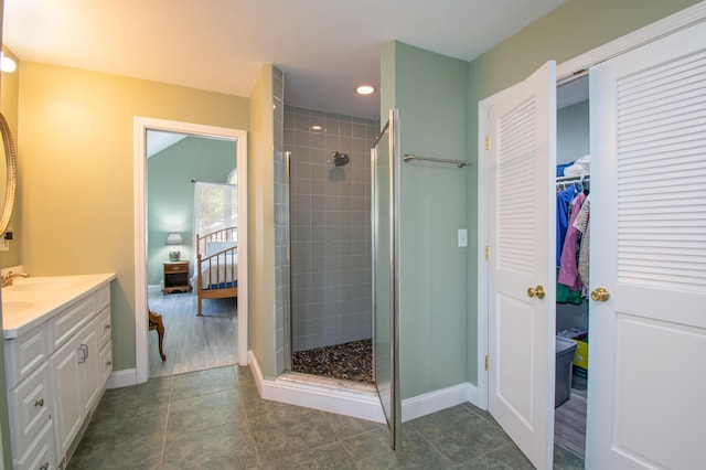 12 Hixon Hill Dr, Woolwich, ME 04579 - full bathroom with vanity, tiled shower, recessed lighting, a spacious closet, and tile patterned flooring