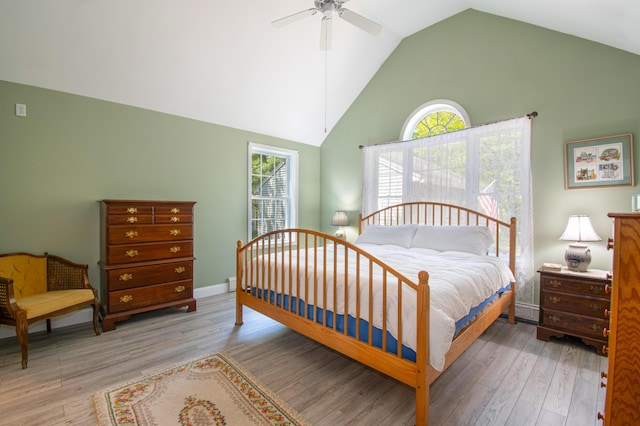 12 Hixon Hill Dr, Woolwich, ME 04579 - bedroom featuring wood finished floors, multiple windows, high vaulted ceiling, and ceiling fan