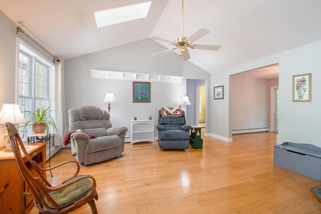 12 Hixon Hill Dr, Woolwich, ME 04579 - sitting room with a baseboard radiator, a skylight, light wood finished floors, baseboard heating, and high vaulted ceiling