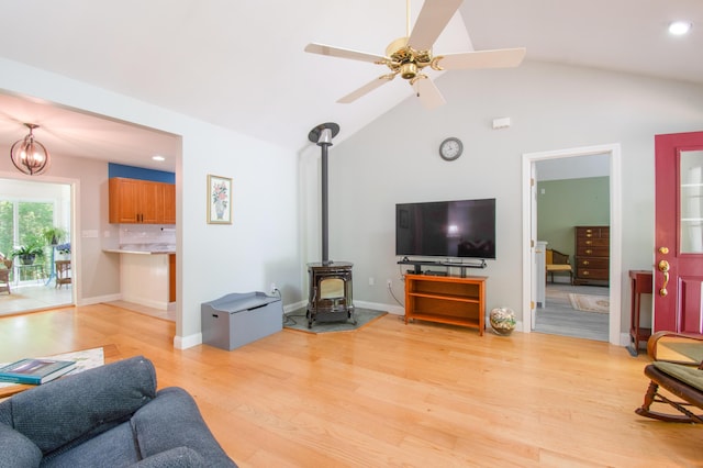 12 Hixon Hill Dr, Woolwich, ME 04579 - living room featuring light wood-type flooring, a wood stove, vaulted ceiling, recessed lighting, and ceiling fan