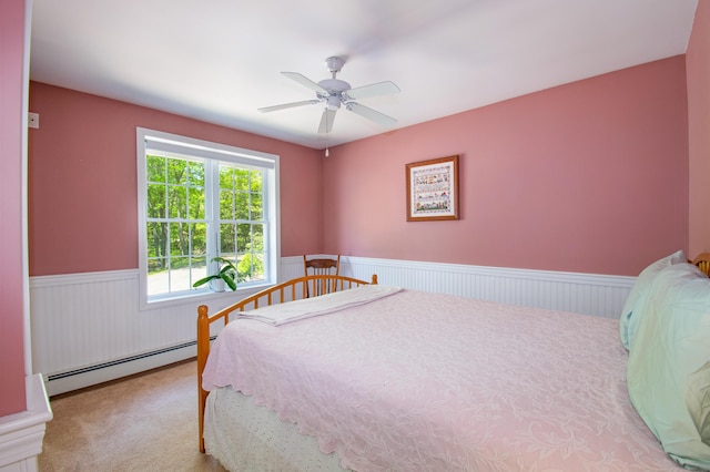 12 Hixon Hill Dr, Woolwich, ME 04579 - carpeted bedroom with baseboard heating, wainscoting, and ceiling fan