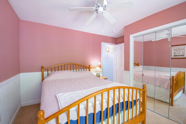 12 Hixon Hill Dr, Woolwich, ME 04579 - bedroom featuring a wainscoted wall, carpet floors, a closet, and ceiling fan