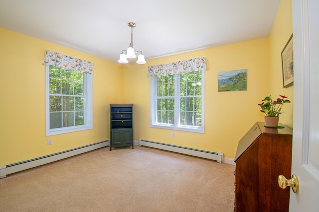 12 Hixon Hill Dr, Woolwich, ME 04579 - carpeted empty room with a baseboard heating unit, plenty of natural light, and a chandelier