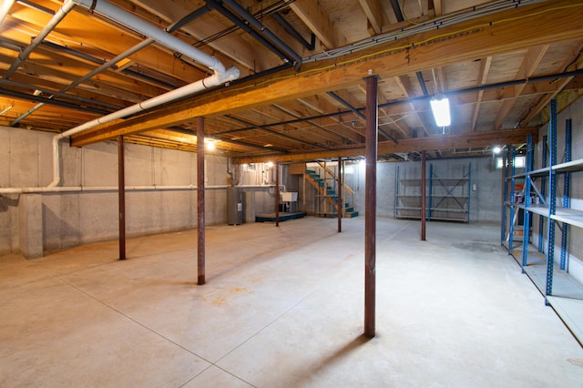 12 Hixon Hill Dr, Woolwich, ME 04579 - unfinished basement featuring stairway and water heater