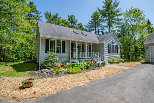 12 Hixon Hill Dr, Woolwich, ME 04579 - single story home with a porch and roof with shingles