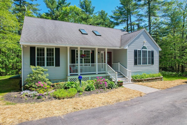 12 Hixon Hill Dr, Woolwich, ME 04579 - ranch-style home with a porch and roof with shingles