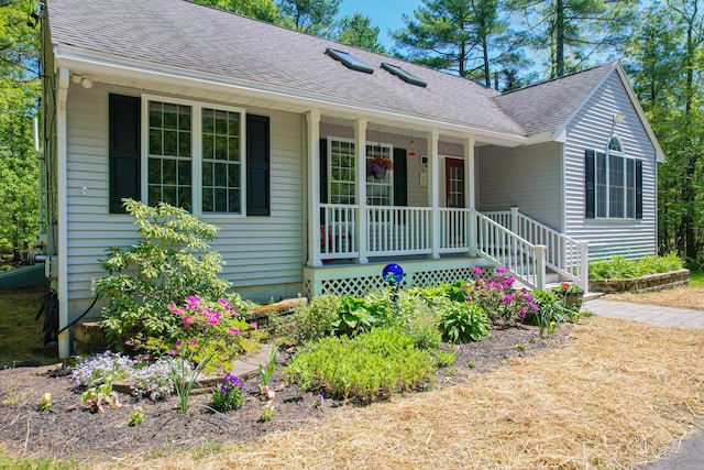 12 Hixon Hill Dr, Woolwich, ME 04579 - ranch-style house with a porch and roof with shingles