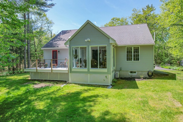 12 Hixon Hill Dr, Woolwich, ME 04579 - rear view of house featuring roof with shingles, a deck, and a lawn
