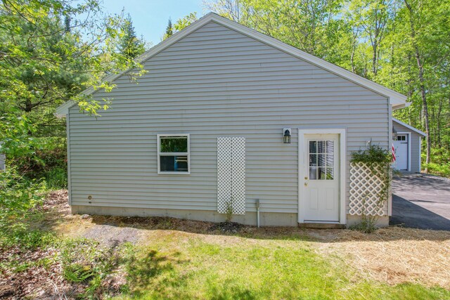 12 Hixon Hill Dr, Woolwich, ME 04579 - view of home's exterior with a garage and an outbuilding