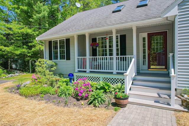 12 Hixon Hill Dr, Woolwich, ME 04579 - view of exterior entry featuring a porch and a shingled roof