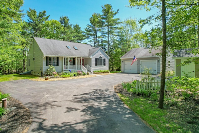 12 Hixon Hill Dr, Woolwich, ME 04579 - view of front facade with asphalt driveway, covered porch, an outdoor structure, and roof with shingles